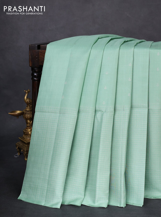 Pure soft silk saree pastel green with allover silver zari buttas and long zari checked border