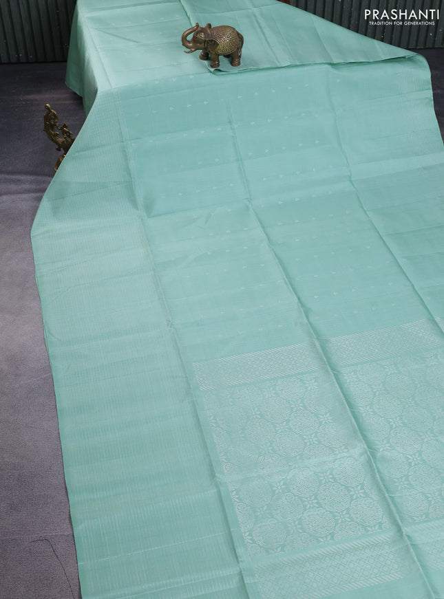 Pure soft silk saree pastel green with allover silver zari buttas and long zari checked border