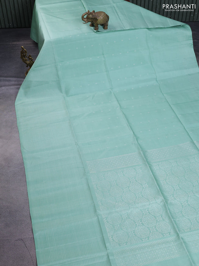 Pure soft silk saree pastel green with allover silver zari buttas and long zari checked border