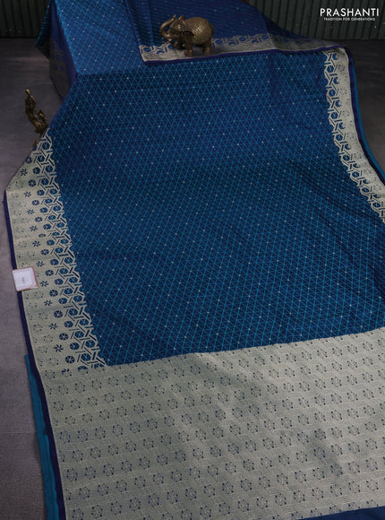 Banarasi semi mushru silk saree dual shade of blue with allover self emboss & zari buttas and zari woven border