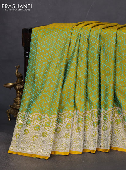 Banarasi semi mushru silk saree dual shade of mustard yellow and teal blue with allover self emboss & zari buttas and zari woven border