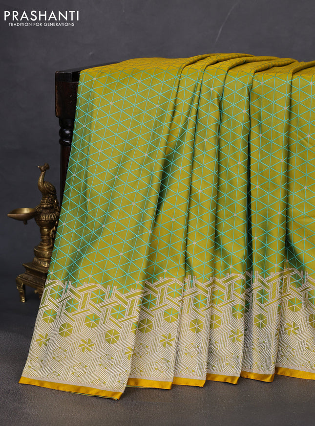 Banarasi semi mushru silk saree dual shade of mustard yellow and teal blue with allover self emboss & zari buttas and zari woven border