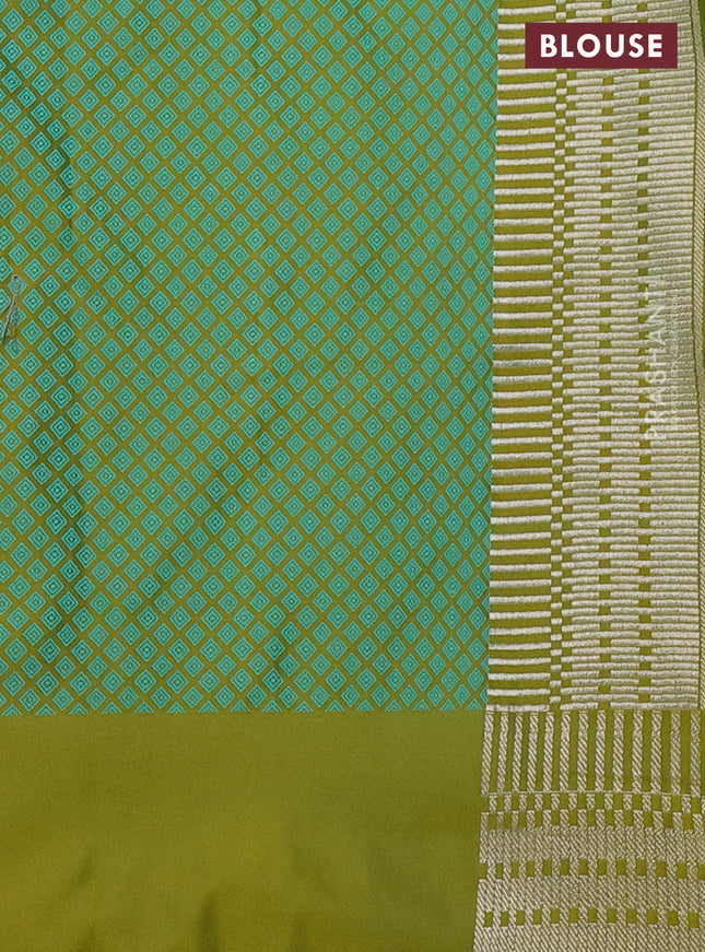 Banarasi semi mushru silk saree dual shade of mustard and teal green shade with allover self emboss and zari woven border