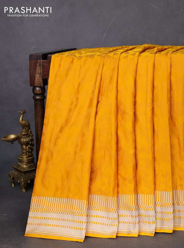 Banarasi semi mushru silk saree mustard yellow with allover self emboss and zari woven border