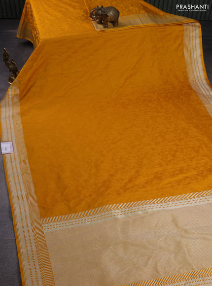 Banarasi semi mushru silk saree mustard yellow with allover self emboss and zari woven border