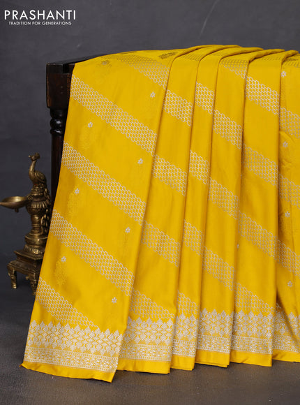 Banarasi semi mushru silk saree mustard yellow with allover self emboss & zari weaves and zari woven border