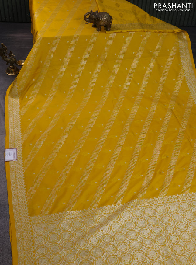 Banarasi semi mushru silk saree mustard yellow with allover self emboss & zari weaves and zari woven border