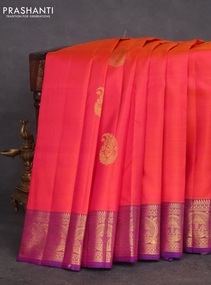 Pure kanchipuram silk saree dual shade of pinkish orange and purple with zari woven buttas and rich zari woven border