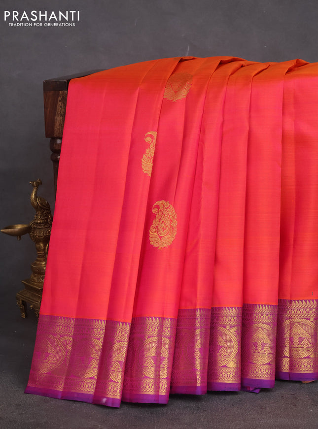 Pure kanchipuram silk saree dual shade of pinkish orange and purple with zari woven buttas and rich zari woven border