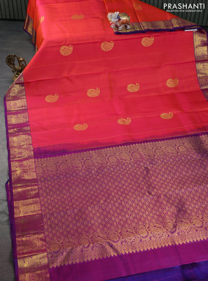 Pure kanchipuram silk saree dual shade of pinkish orange and purple with zari woven buttas and rich zari woven border