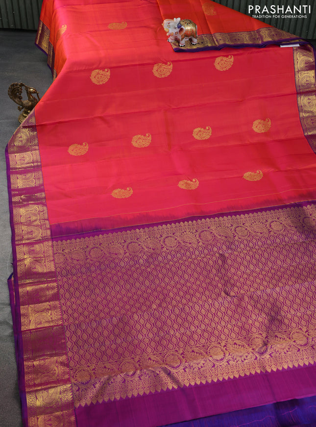 Pure kanchipuram silk saree dual shade of pinkish orange and purple with zari woven buttas and rich zari woven border