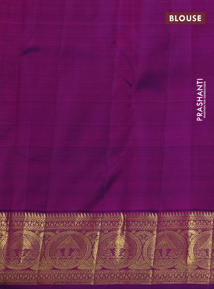 Pure kanchipuram silk saree dual shade of pinkish orange and purple with zari woven buttas and rich zari woven border