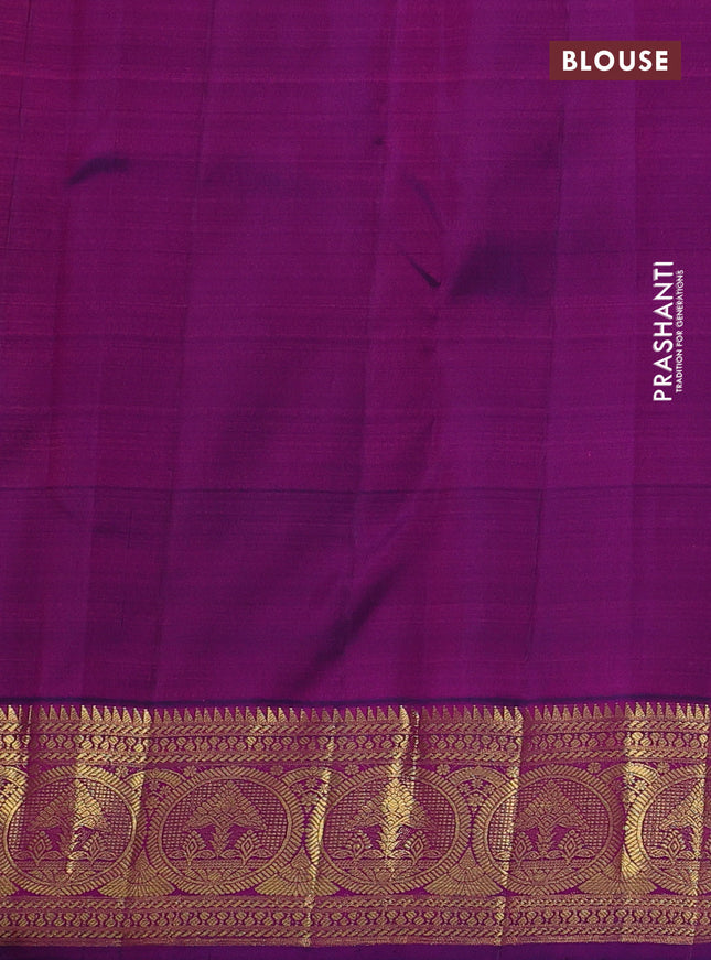 Pure kanchipuram silk saree dual shade of pinkish orange and purple with zari woven buttas and rich zari woven border
