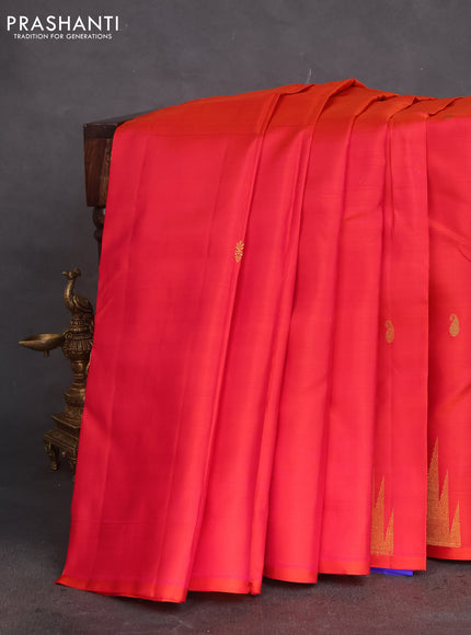 Pure kanchipuram silk saree dual shade of pinkish orange and blue with zari woven buttas and temple design zari woven border