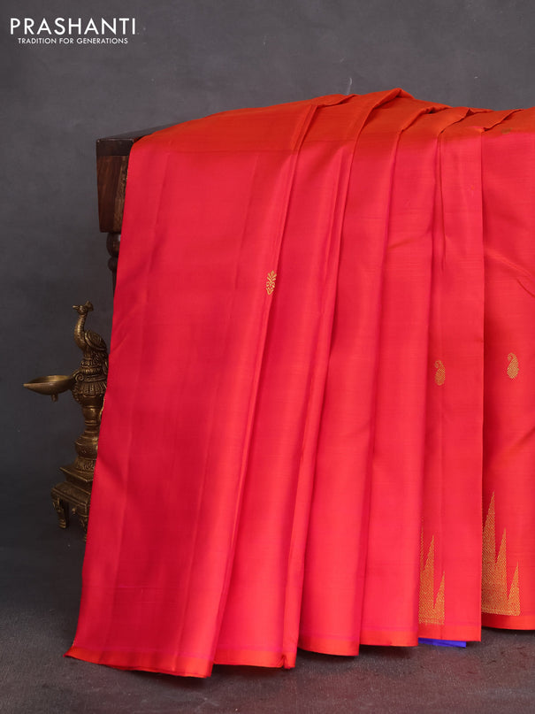 Pure kanchipuram silk saree dual shade of pinkish orange and blue with zari woven buttas and temple design zari woven border