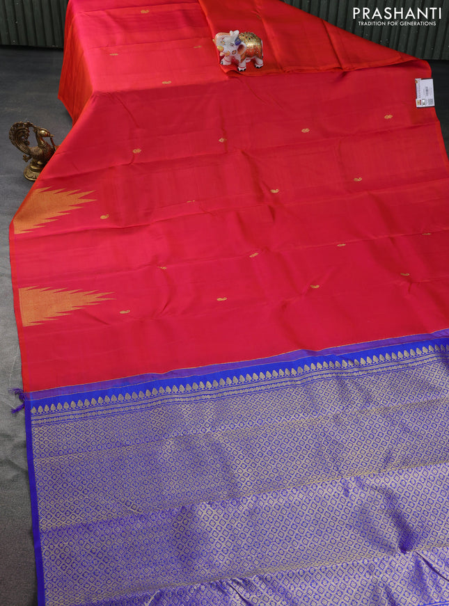 Pure kanchipuram silk saree dual shade of pinkish orange and blue with zari woven buttas and temple design zari woven border