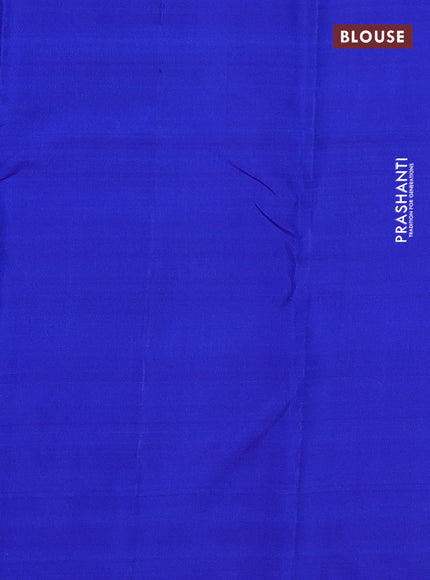 Pure kanchipuram silk saree dual shade of pinkish orange and blue with zari woven buttas and temple design zari woven border