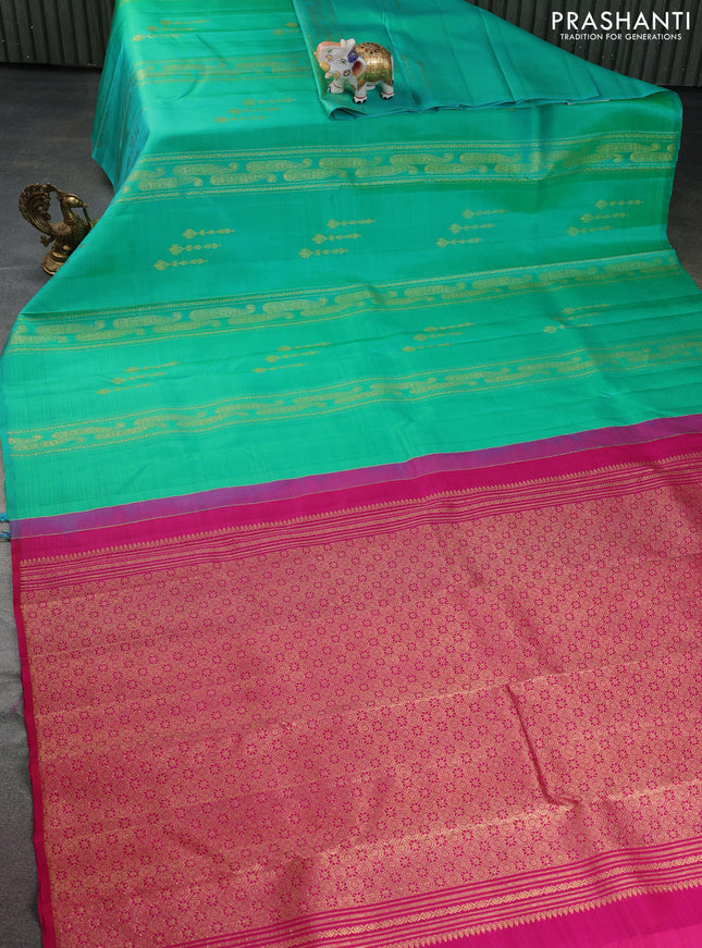 Pure kanchipuram silk saree dual shade of teal bluish green and pink with allover zariw weaves & buttas in borderless style
