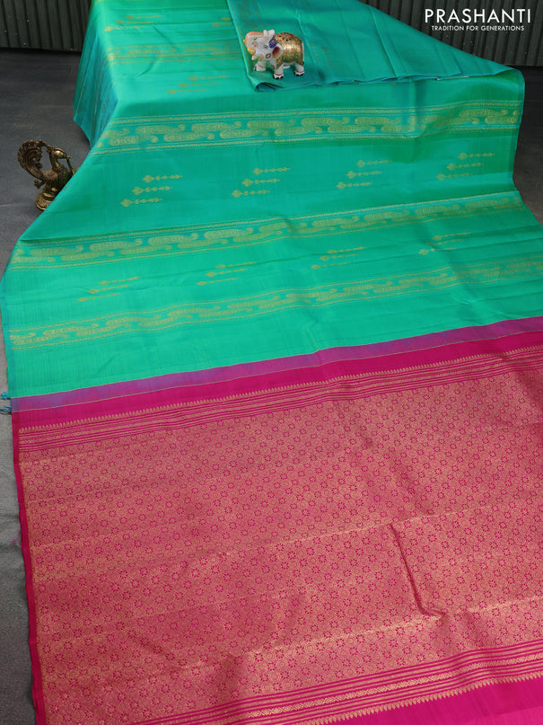 Pure kanchipuram silk saree dual shade of teal bluish green and pink with allover zariw weaves & buttas in borderless style