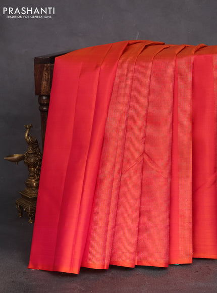 Pure kanchipuram silk saree dual shade of pinkish orange and teal green with zari woven buttas in borderless style