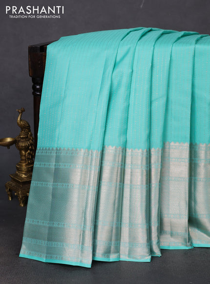 Pure kanchipuram silk saree teal blue with allover silver zari weaves and long silver zari woven border