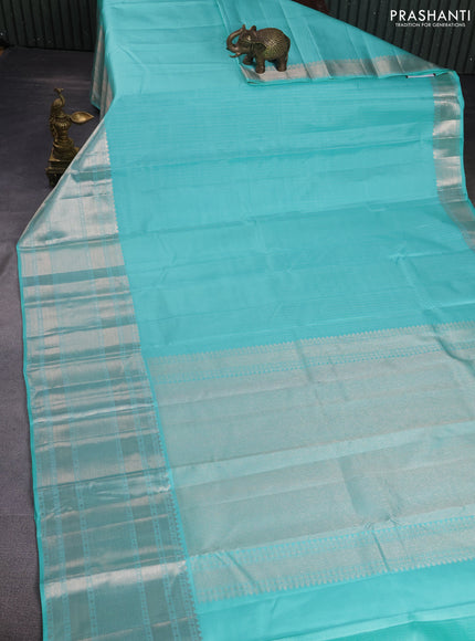 Pure kanchipuram silk saree teal blue with allover silver zari weaves and long silver zari woven border