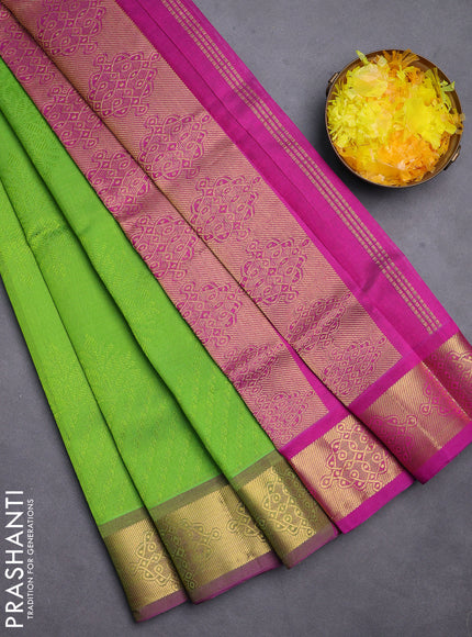Silk cotton saree parrot green and purple with allover self emboss jacquard and zari woven border
