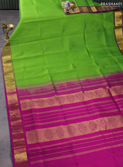 Silk cotton saree parrot green and purple with allover self emboss jacquard and zari woven border