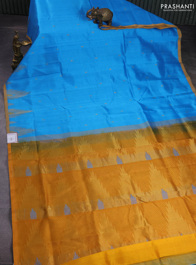 Silk cotton saree blue and dark mustard with zari woven buttas and temple design zari woven butta border