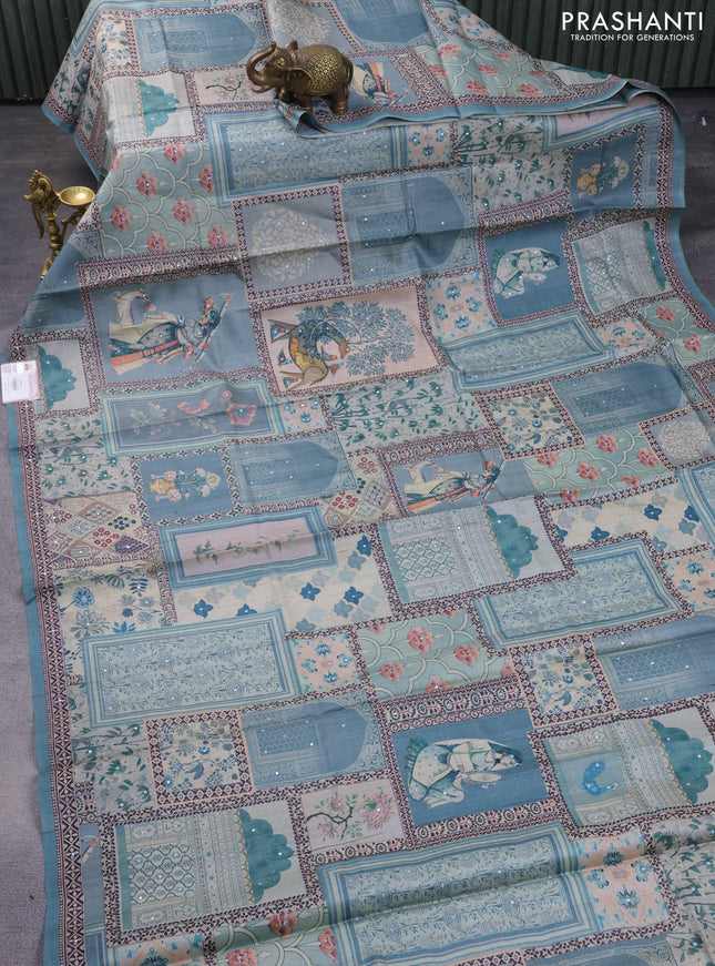Pure tussar silk saree teal blue with allover prints & mirror work and printed border