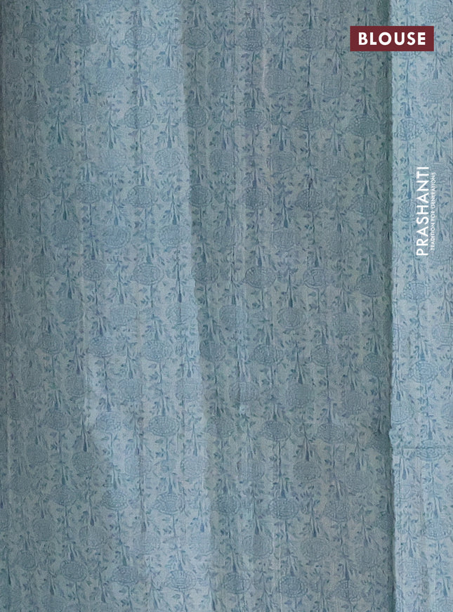 Pure tussar silk saree teal blue with allover prints & mirror work and printed border