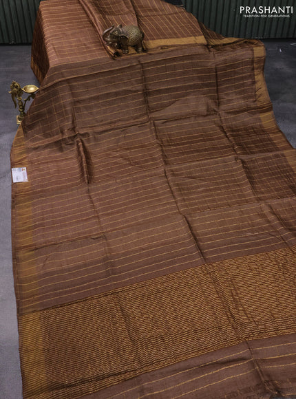Pure tussar silk saree brown shade and teal green with allover zari checked pattern and zari woven border