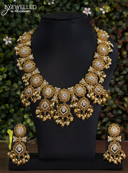 Antique guttapusalu necklace with pink kemp & cz stones and gold beads hanging