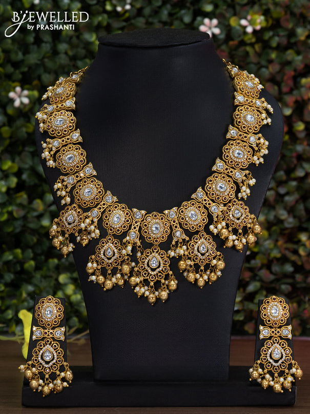 Antique guttapusalu necklace with pink kemp & cz stones and gold beads hanging