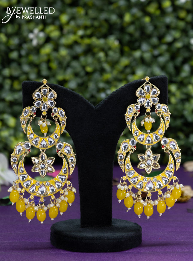 Fashion dangler yellow earrings with kundan stones and beads hangings