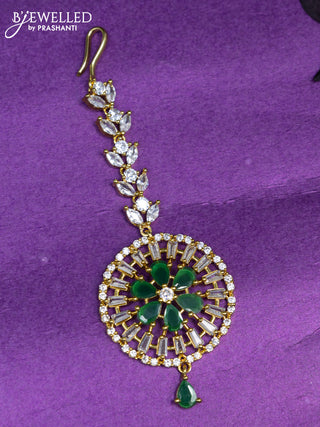 Zircon maang tikka with emerald & cz stones and hangings in gold finish