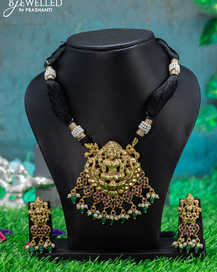 Black thread necklace with kemp stone lakshmi pendant and green beads hangings