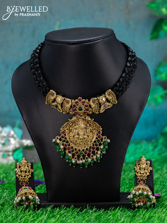 Black thread necklace with lakshmi pendant & kemp stone and green beads hanging