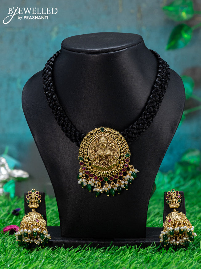 Black thread necklace with lakshmi pendant & kemp stone and green beads hanging
