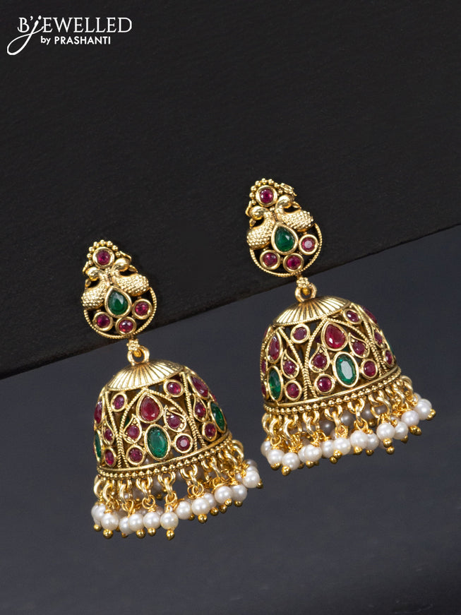 Antique jhumka peacock design with kemp stones and pearl hangings