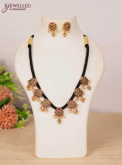 Black thread necklace with kemp stones and pearl & golden beads hangings