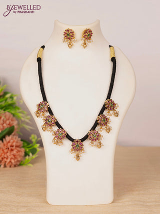 Black thread necklace with kemp stones and pearl & golden beads hangings