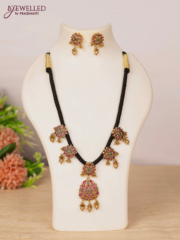Black thread necklace with kemp stones and golden beads hangings