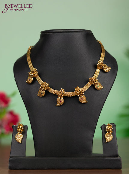 Antique attigai necklace in maanga design with kemp and green stones