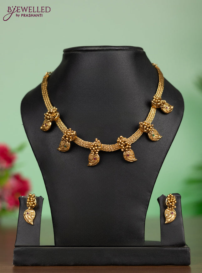 Antique attigai necklace in maanga design with kemp and green stones