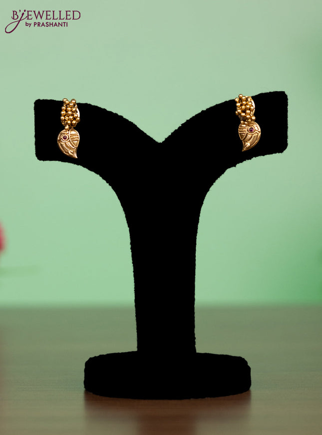 Antique attigai necklace in maanga design with kemp and green stones