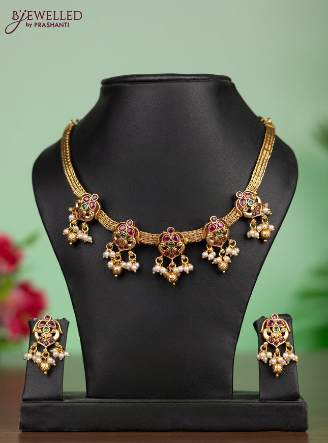 Antique attigai necklace in double peacock design with kemp stones and pearl hanging
