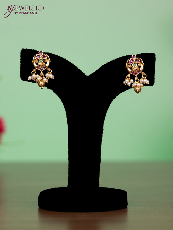 Antique attigai necklace in double peacock design with kemp stones and pearl hanging