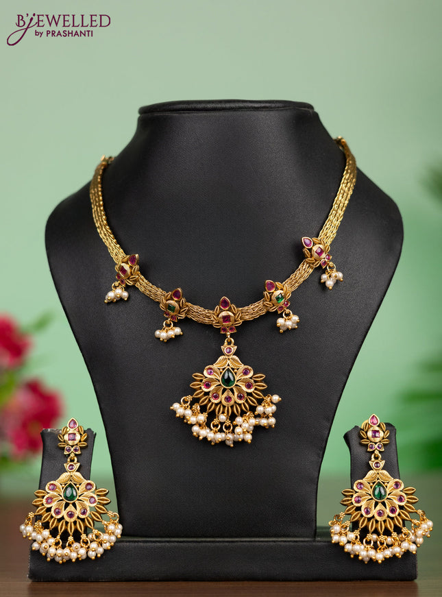Antique attigai necklace in floral design with kemp stones and pearl hanging