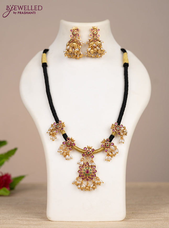 Black thread necklace with kemp stones and pearl & golden beads hangings